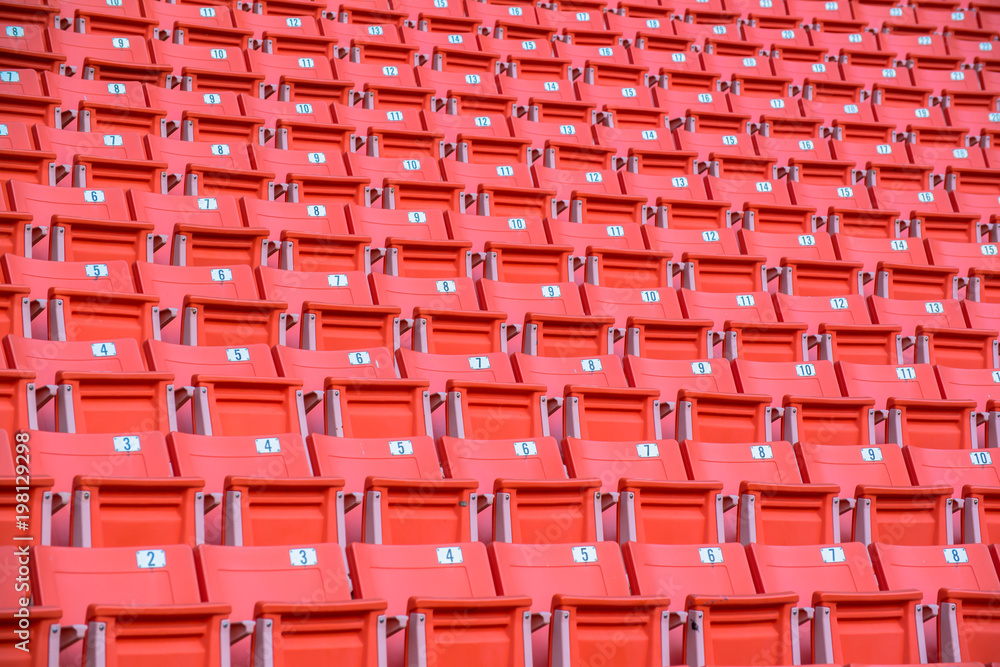 Fototapeta premium Many orange chairs in football stadium.