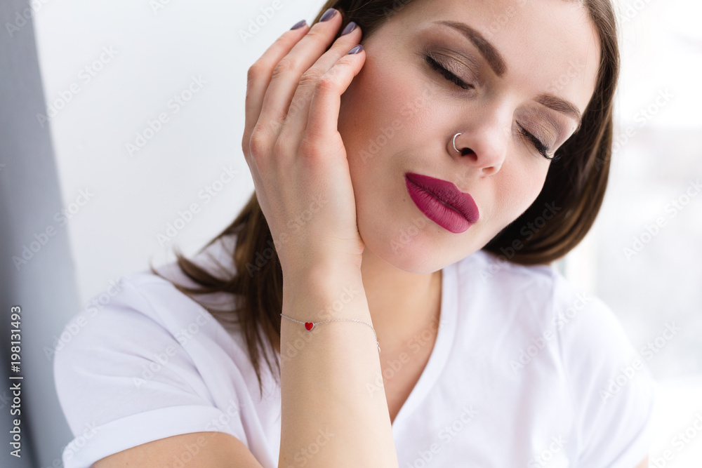 Beautiful stylish woman wearing red hearth bracelet Beautiful stylish woman wearing red hearth bracelet