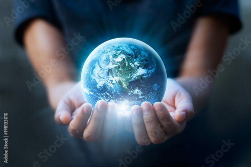 Fototapeta Naklejka Na Ścianę i Meble -  Earth day, Human hands holding blue earth, save earth concept. Elements of this image furnished by NASA