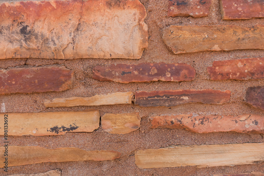 Close-up view of a rough brick wall near Alice Springs in the outback of the Northern Territory in Australia Close-up view of a rough brick wall near Alice Springs in the outback of the Northern Territory in Australia