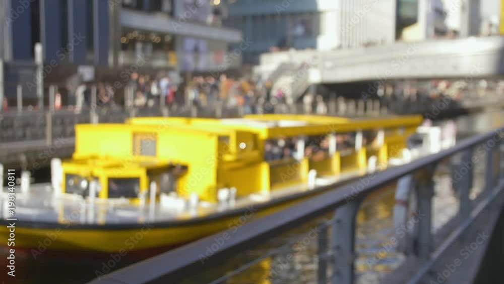 International tourists chatting by a busy canal, flycam. International tourists chatting by a busy canal, flycam.