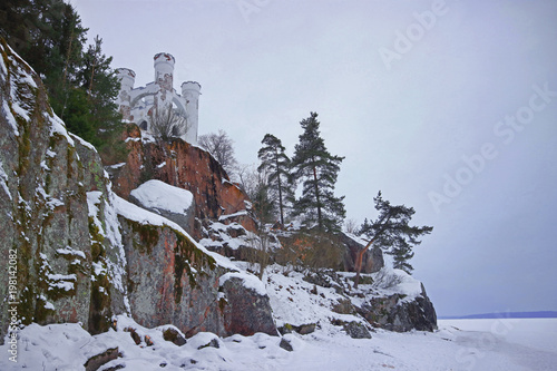 castle on a rock in a winter forest (Monrepo is a rocky landscape park on the shores of the Bay of Protective Vyborg 2018) photo