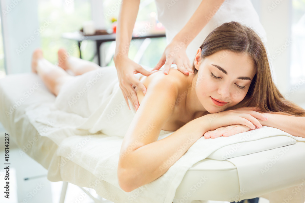 Leisure background, Beautiful girl is relax smile by handle massage, luxury spa Health and Beauty Background. Leisure background, Beautiful girl is relax smile by handle massage, luxury spa Health and Beauty Background.