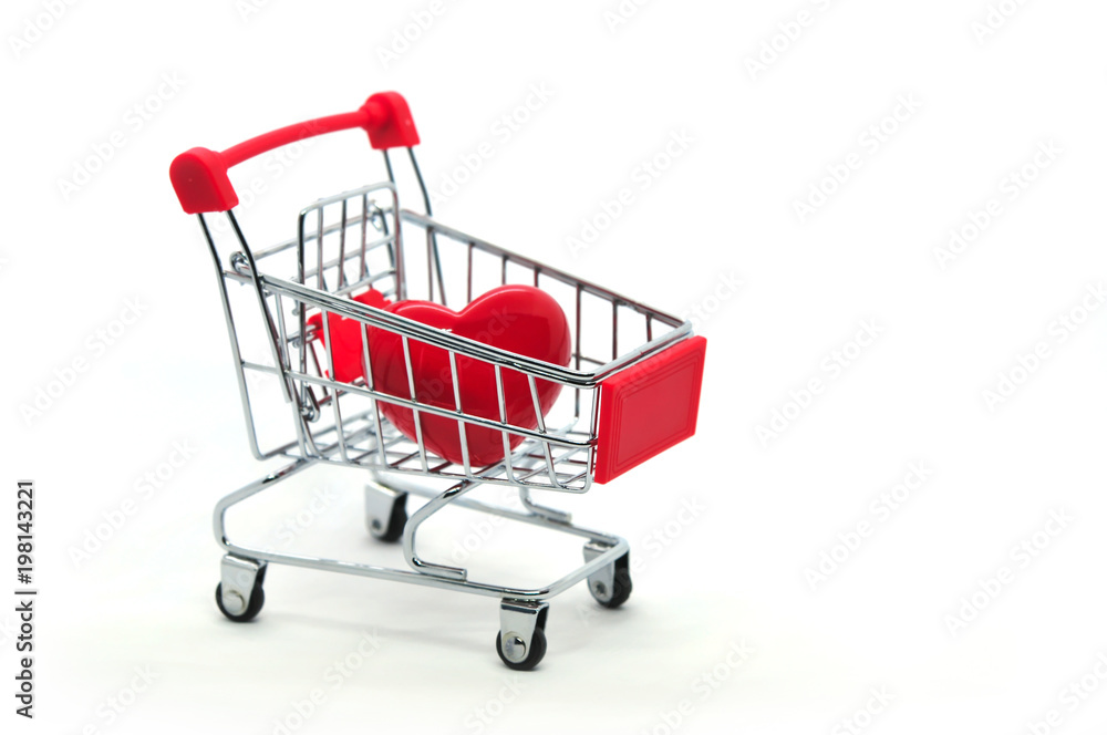 Red heart in a shopping cart isolated on white background Red heart in a shopping cart isolated on white background