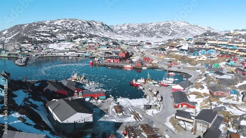 Beautiful town, small village south of Greenland. Qaqortoq town with beautiful colorful house from aerial view.