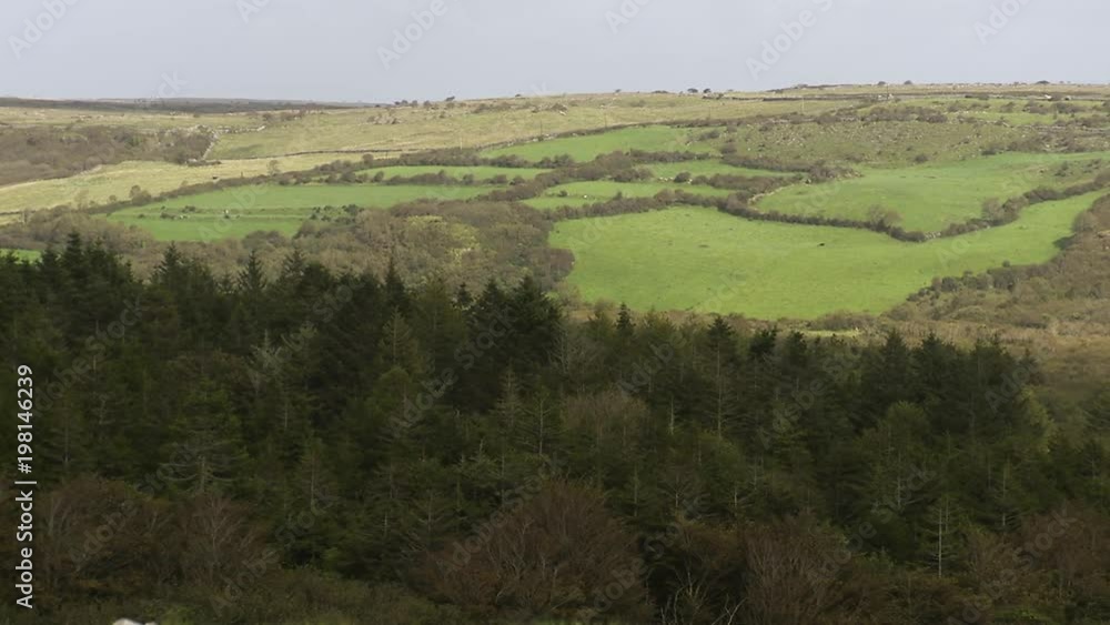 A scenic wide shot of a green landscape in Ireland. A scenic wide shot of a green landscape in Ireland.