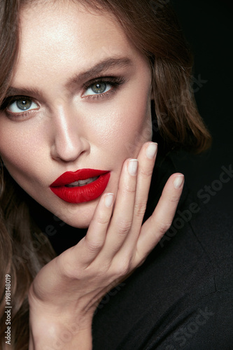 Beautiful Woman Face With Makeup And Red Lips.