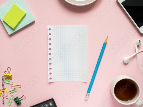 Business flat lay with copy space on a background pink Notebooks to write text stickers Pencil, Stationery color paper clip, calculator photo