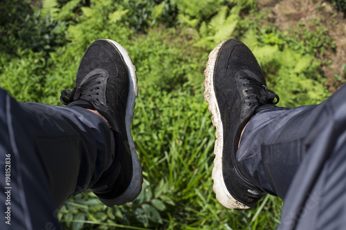 Feet of a tourist on the background of mountains © ala