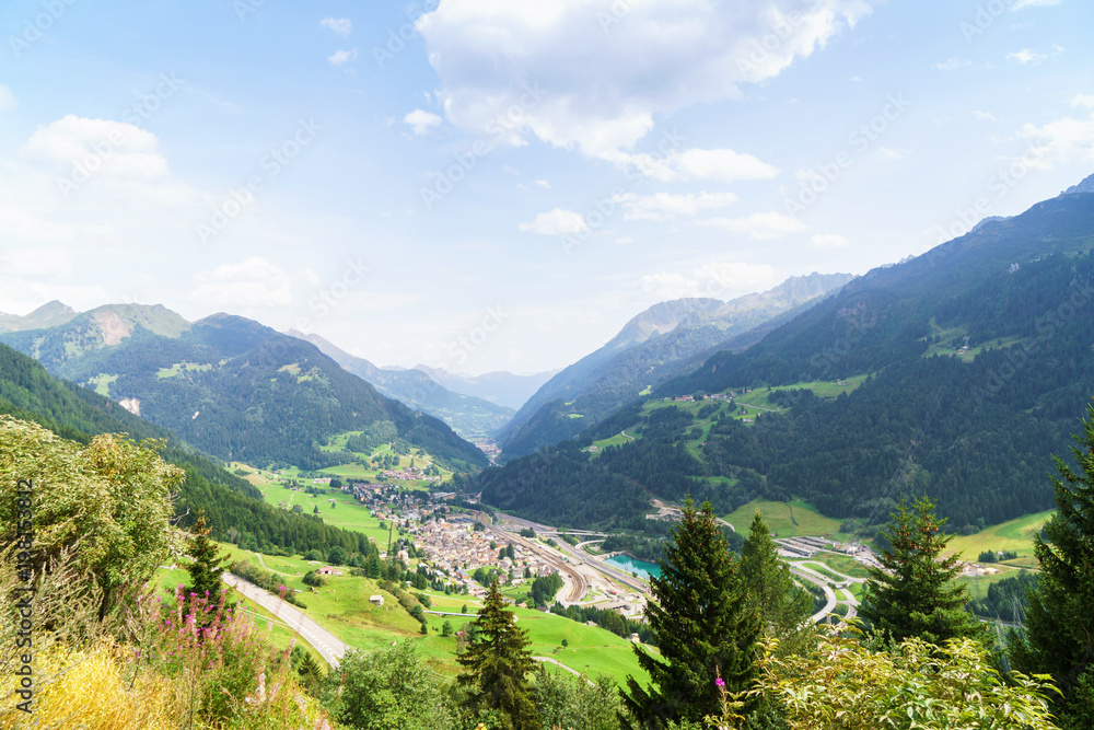 Swiss landscape with Alpine village and mountains around. 