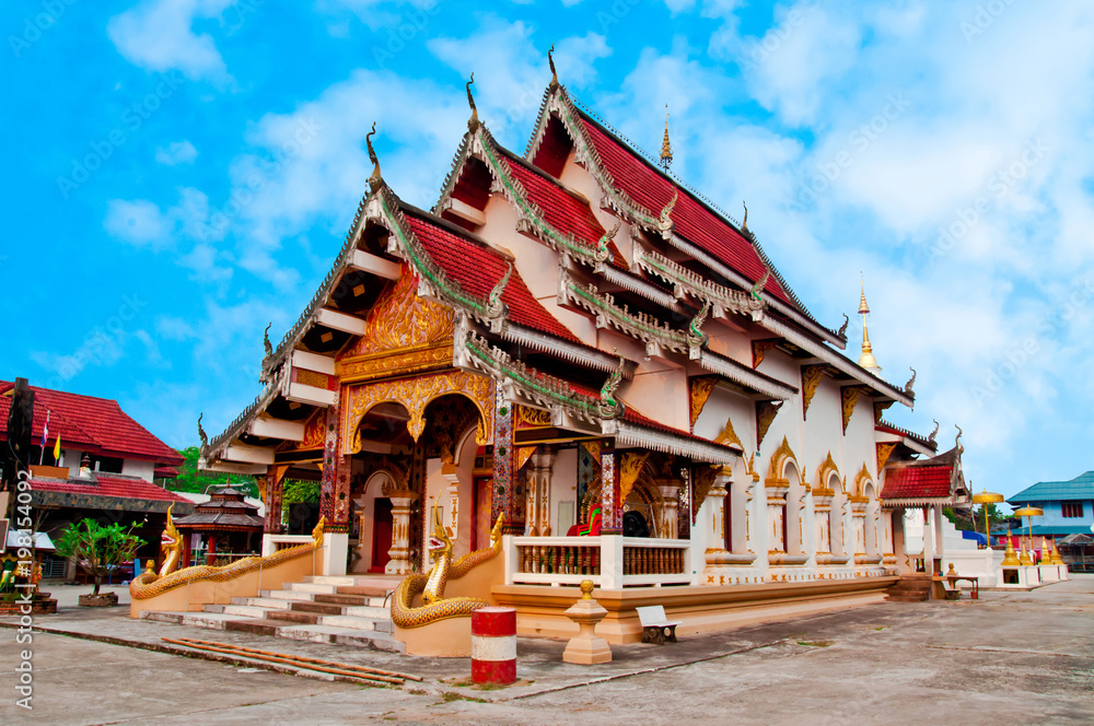 Fototapeta premium Golden Pagoda and Temple in Tha Wang Thong District, Phayao Province.