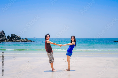 couple love on the beach.a man carrying a woman near the sea on vacation.tourist enjoying on holiday © Anusorn