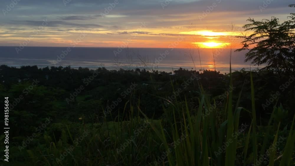 Aerial landscape view of a dramatic sunset as from the Highlands of Rarotonga, Cook Islands Aerial landscape view of a dramatic sunset as from the Highlands of Rarotonga, Cook Islands