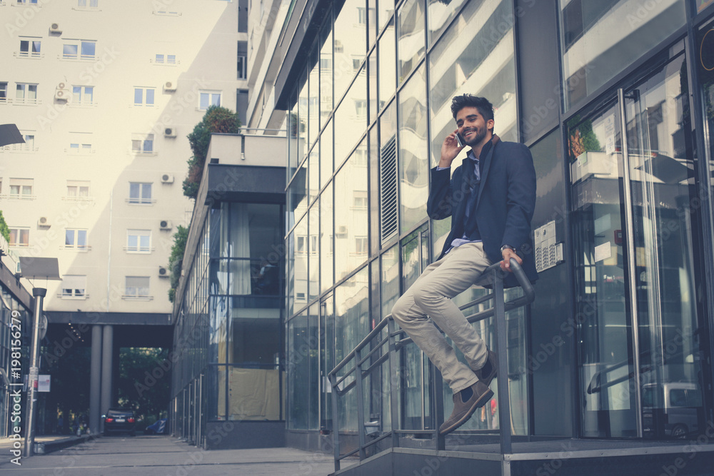 Business man talking on mobile phone.