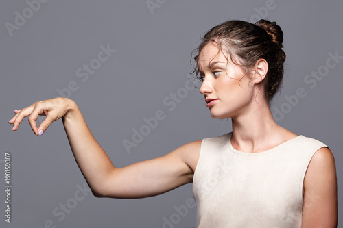 Young woman showing and presenting copy space by fingers