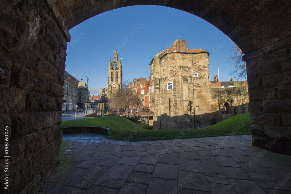 The Black Gate, Newcastle-Upon-Tyne, Castle viewed through the stone railway arch creating an suitably strong frame