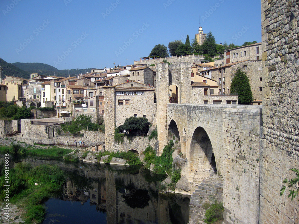 View of the old city of Besalu, arch bridge, old town, sunny day, Catalonia, Spain
