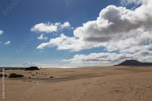 Sand against cloudy sky
