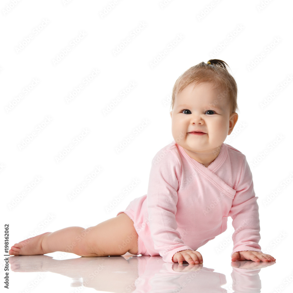 8 month infant child baby girl toddler lying in white shirt looking up 8 month infant child baby girl toddler lying in white shirt looking up