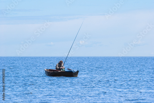 fisher in boat at Baikal