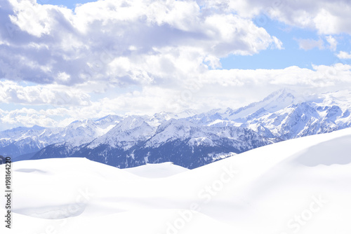 the peaks of the Alps in winter with soft snow