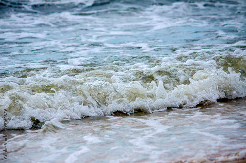 Strong waves crash over the beach at Sea of Azov