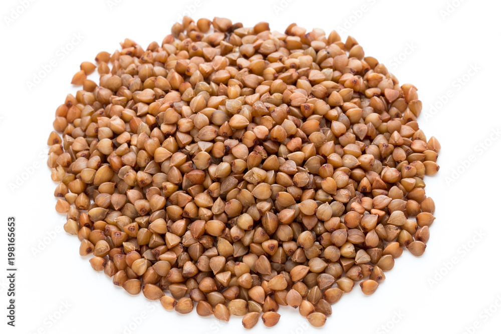 Buckwheat grains isolated on the white background. Buckwheat grains isolated on the white background.
