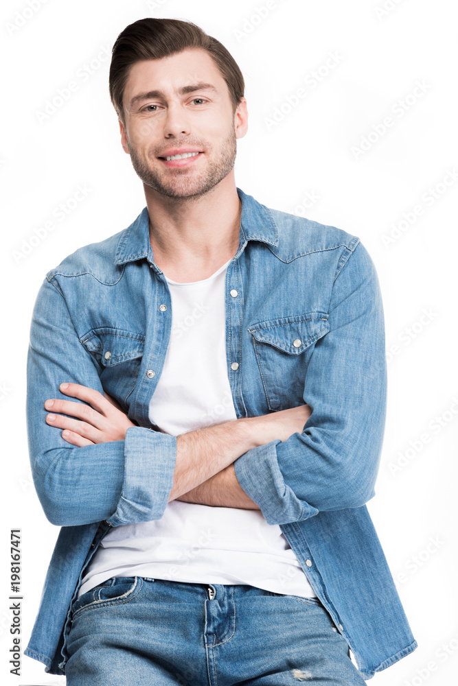 young man with crossed arms looking at camera, isolated on white young man with crossed arms looking at camera, isolated on white