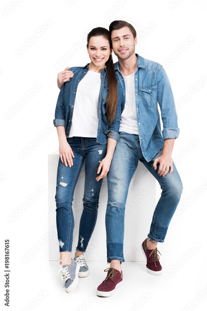 hugging smiling couple in jeans, isolated on white hugging smiling couple in jeans, isolated on white