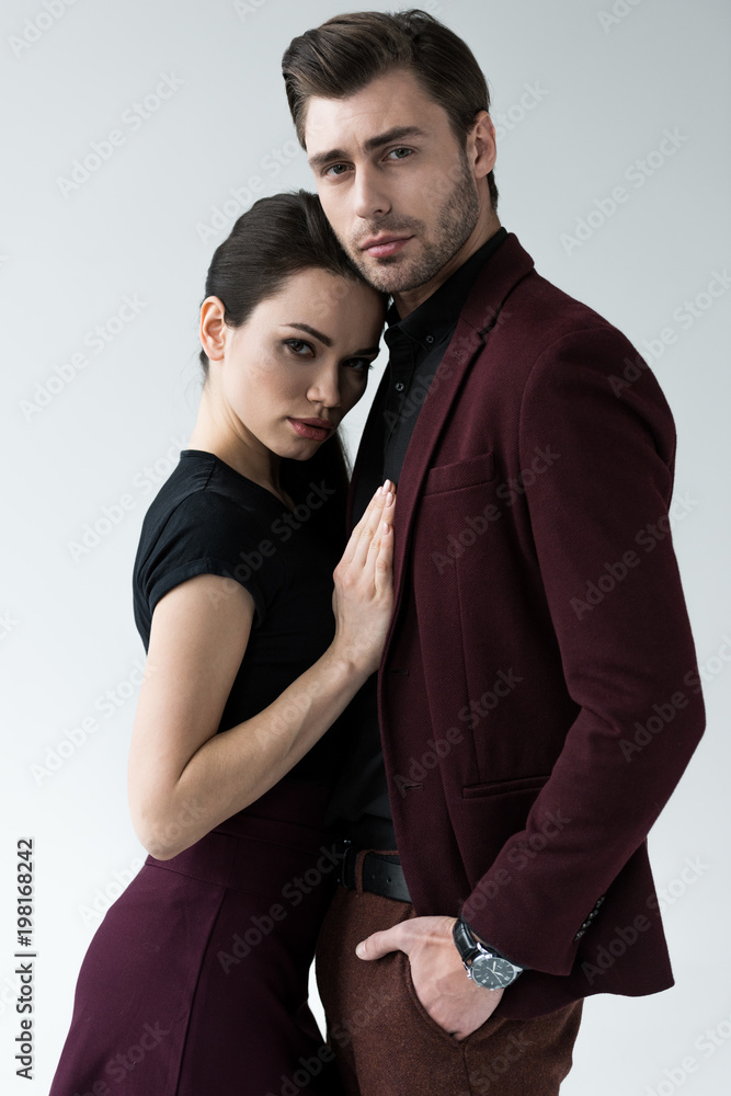 beautiful hugging couple, isolated on grey beautiful hugging couple, isolated on grey