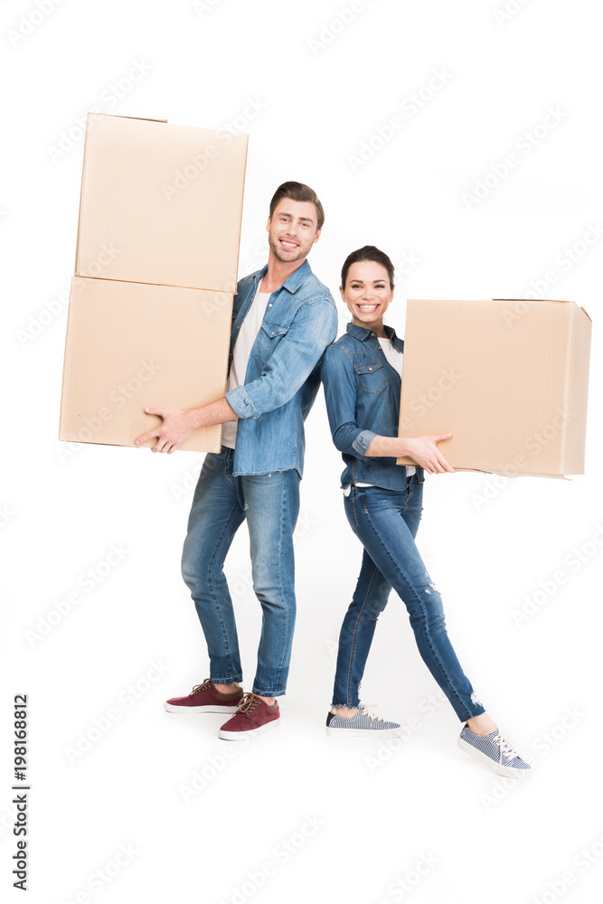 smiling couple holding cardboard boxes, isolated on white smiling couple holding cardboard boxes, isolated on white