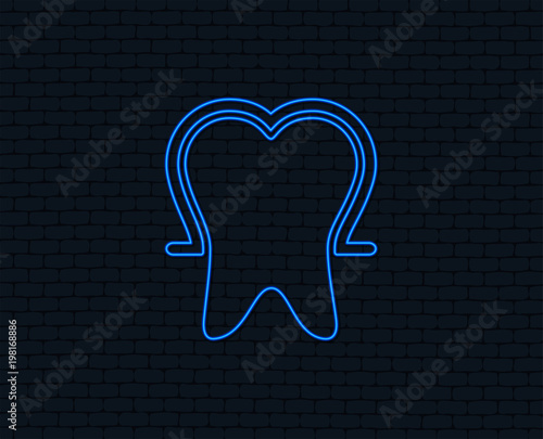 Neon light. Tooth enamel protection sign icon. Dental toothpaste care symbol. Healthy teeth. Glowing graphic design. Brick wall. Vector