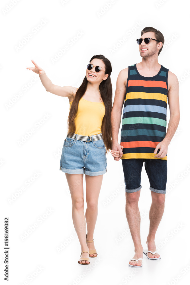 girl pointing and holding hands with boyfriend, isolated on white girl pointing and holding hands with boyfriend, isolated on white