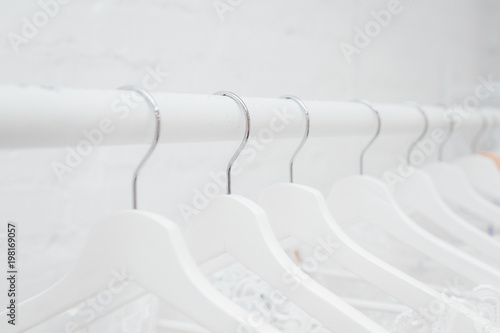 Hangers row all white with black hooks
