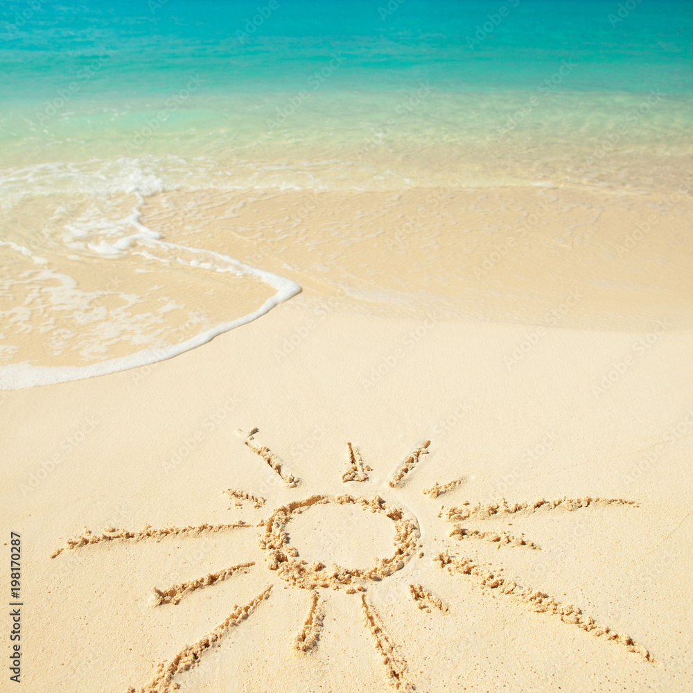 Sun drawn on sand of Tropical beach. Ocean beach background. White ...