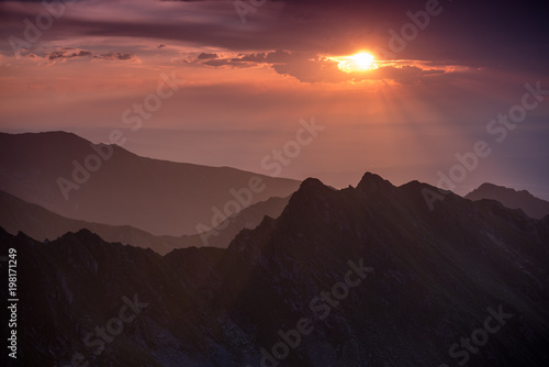 Beautiful colors at sunrise over the Fagaras ridges, the highest mountains from Romania