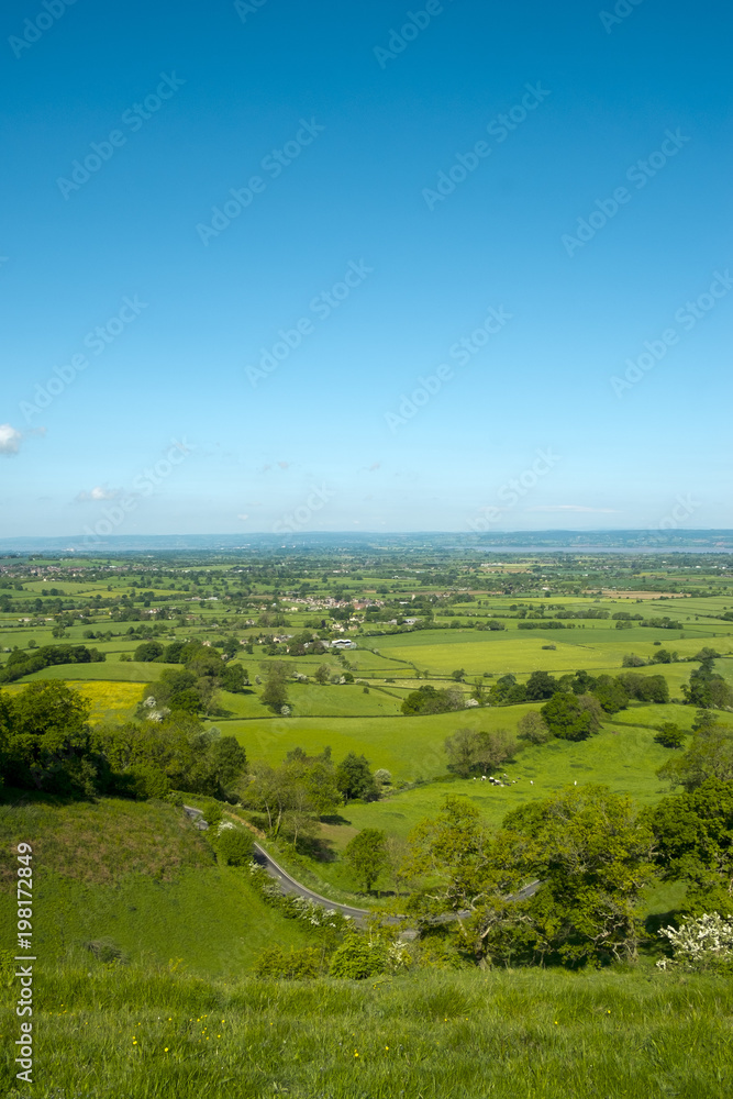 View over The Severn Vale from The Cotswold Way long distance footpath at Coaley Peak viewpoint, Cotswolds, Gloucestershire, UK