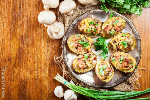 Baked potatoes stuffed with bacon, mushrooms and cheese