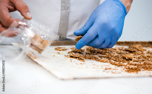 Confectioner preparing cookies, confectionery industry