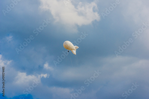 Military Aerostat in a beautiful sky with dramatic clouds