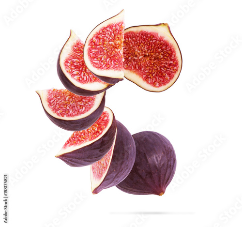 Figs cut into pieces on a white background photo