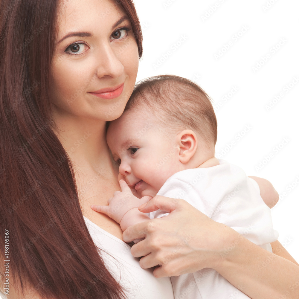 Portrait of mother and her little child in white. Happy family concept. Mother holding cute baby isolated on white background. . Motherhood and children concept. Close up Portrait of mother and her little child in white. Happy family concept. Mother holding cute baby isolated on white background. . Motherhood and children concept. Close up