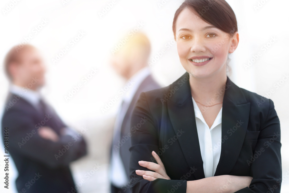 successful young business woman on the background of the office. successful young business woman on the background of the office.