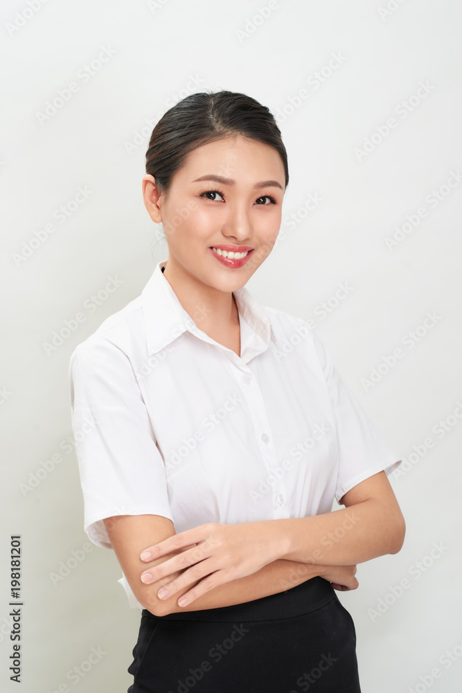 Beautiful happy asian young smiling business woman in white shirt and skirt holding Beautiful happy asian young smiling business woman in white shirt and skirt holding