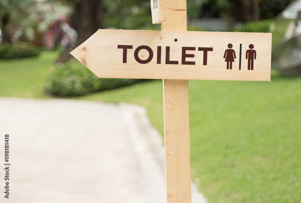 Wooden Toilet Sign in Garden