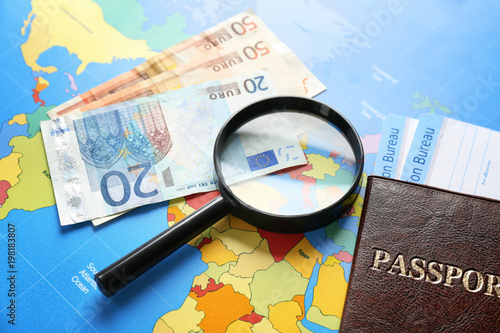 Passport, money and magnify...
