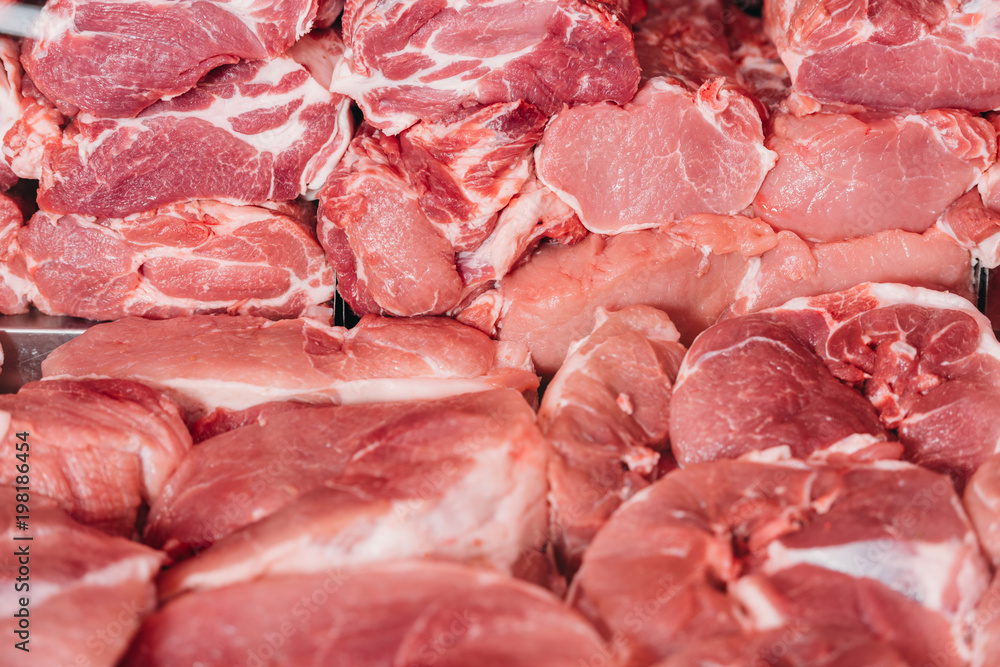 close up view of arranged raw meat in grocery shop