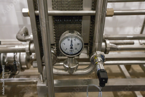 Pressure gauge (manometer) of white metal - brewing equipment. Close-up, macro. 