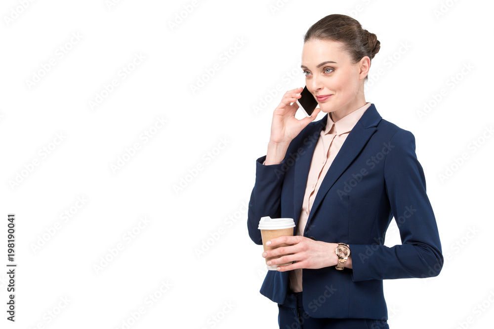 adult businesswoman with coffee to go talking by phone isolated on white adult businesswoman with coffee to go talking by phone isolated on white
