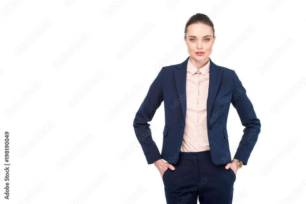 stylish adult businesswoman with hands in pockets looking at camera isolated on white stylish adult businesswoman with hands in pockets looking at camera isolated on white